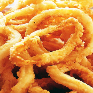 Fried onion rings with golden crispy breading and wavy texture in a bowl.