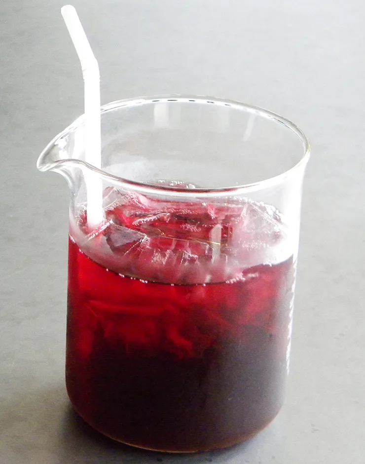 Thai iced hibiscus drink in a glass mug